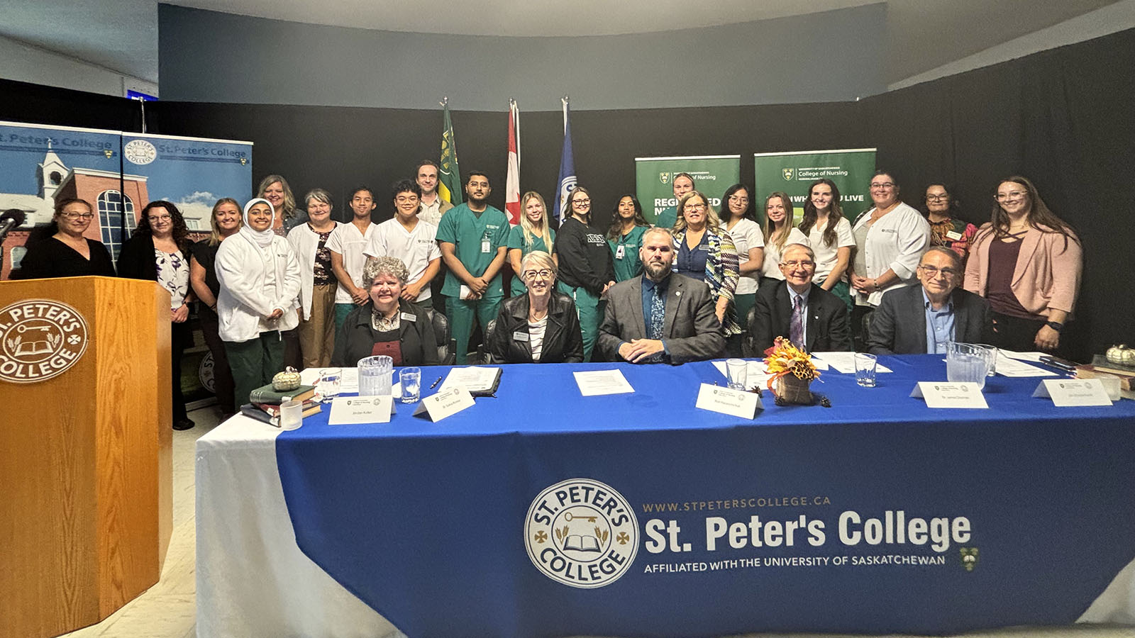 group photo of students, instructors, staff, and faculty that attended the event, gathered together and smiling.