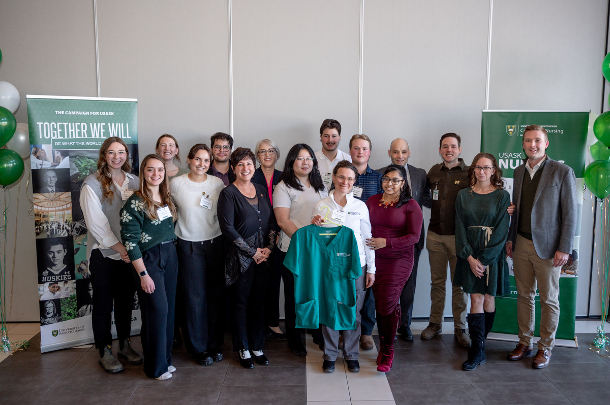 Group photo of some of the staff, faculty, students, and guests who attended the event